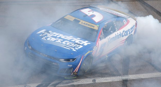 KANSAS CITY, KANSAS - SEPTEMBER 27: Kyle Larson, driver of the #5 HendrickCars.com Chevrolet, celebrates with a burnout after winning the NASCAR Cup Series Hollywood Casino 400 at Kansas Speedway on September 27, 2026 in Kansas City, Kansas. (Photo by Jonathan Bachman/Getty Images) | Getty Images