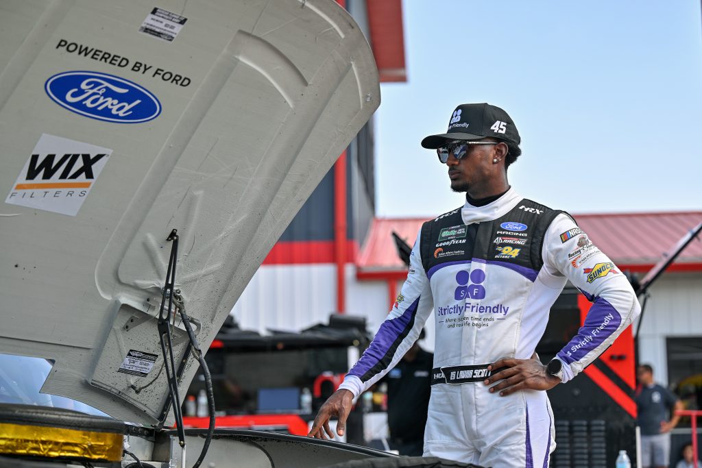 MADISON, ILLINOIS - SEPTEMBER 12: Lavar Scott, driver of the #45 Strictly Friendly Ford, looks on during qualifying for the NASCAR O'Reilly Auto Parts Series Nu Way 225 Powered by Bobcat and Sauced by Blues Hog at WWT Raceway on September 12, 2026 in Madison, Illinois. (Photo by Amy Kontras/Getty Images) | Getty Images