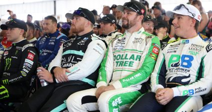LONG POND, PENNSYLVANIA - JUNE 14: (L-R) Ty Gibbs, driver of the #54 Monster Energy Toyota, Chris Buescher, driver of the #17 BuildSubmarines.com Ford, Erik Jones, driver of the #43 Dollar Tree Toyota, and John H. Nemechek, driver of the #42 Pye-Barker Fire & Safety Toyota, attend the during the drivers meeting prior to the NASCAR Cup Series Great American Getaway 400 presented by VISITPA at Pocono Raceway on June 14, 2026 in Long Pond, Pennsylvania. (Photo by James Gilbert/Getty Images) | Getty Images