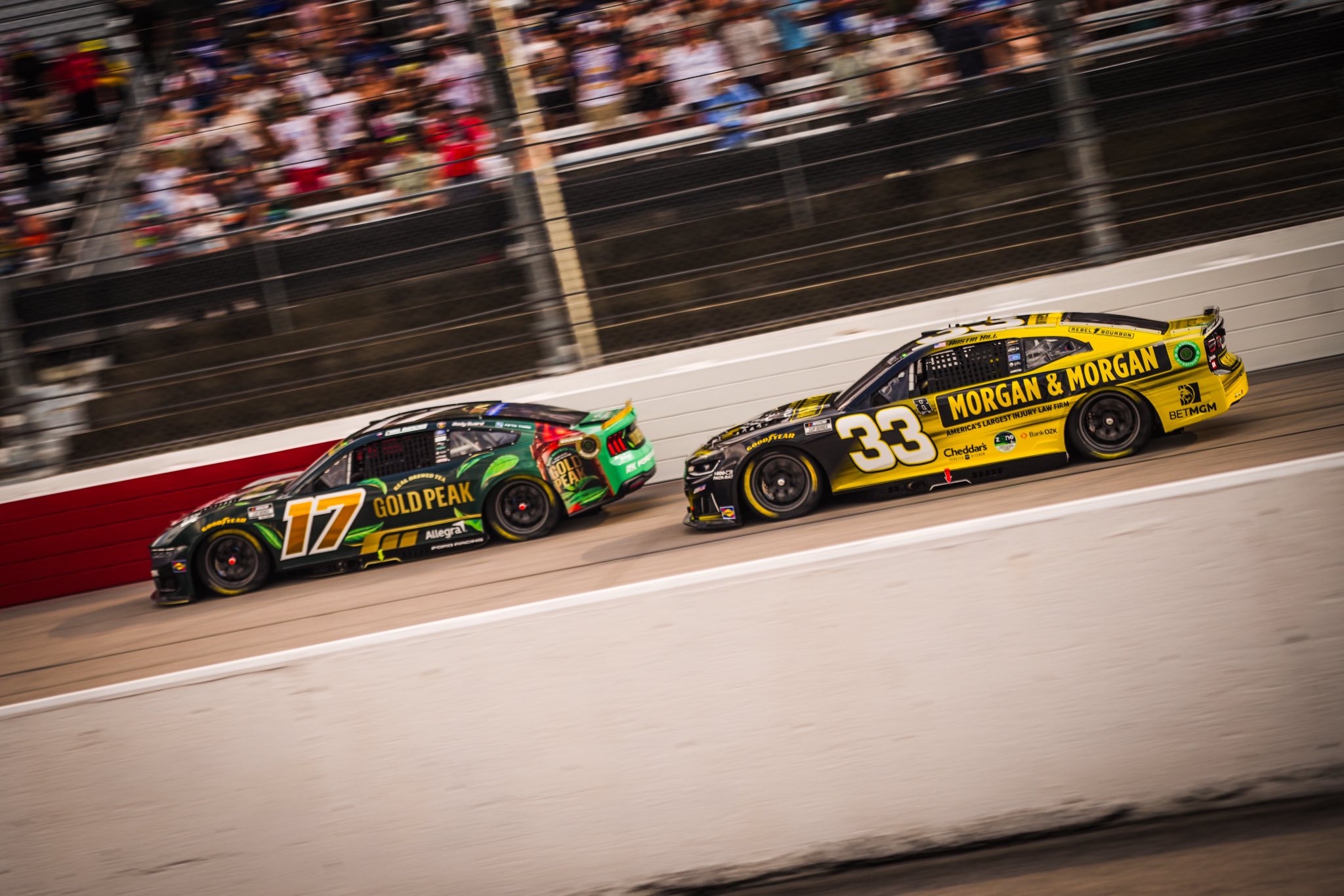DARLINGTON, SOUTH CAROLINA - SEPTEMBER 06: Chris Buescher, driver of the #17 Kroger Gold Peak Ford, and Austin Hill, driver of the #33 Morgan & Morgan Chevrolet drive during the NASCAR Cup Series Cook Out Southern 500 at Darlington Raceway on September 06, 2026 in Darlington, South Carolina. (Photo from RFK Racing)