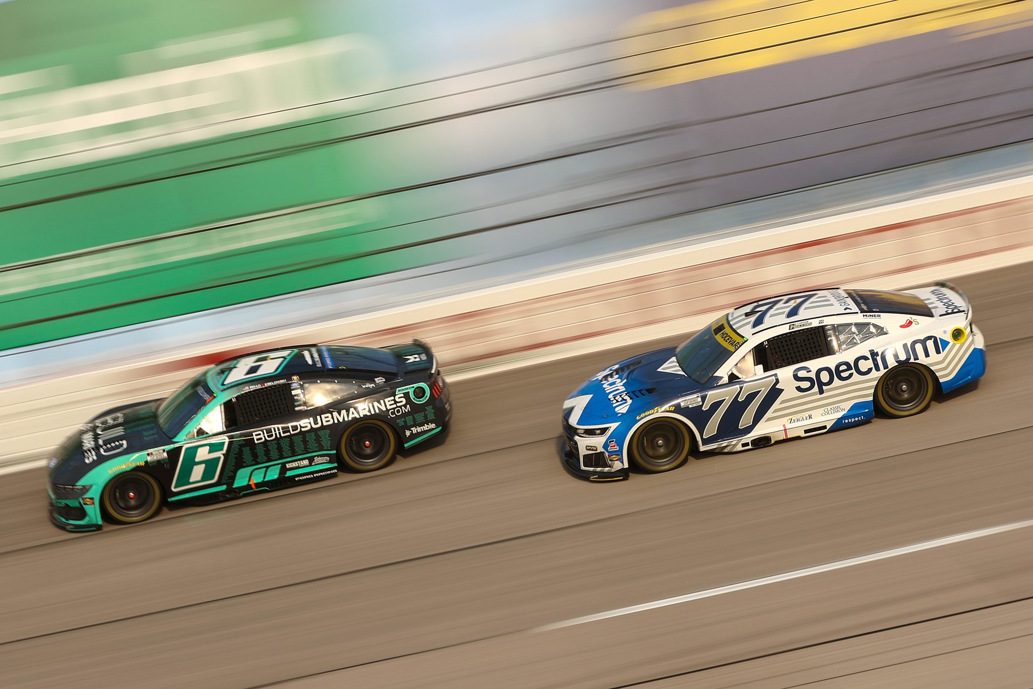 DARLINGTON, SOUTH CAROLINA - SEPTEMBER 06: Brad Keselowski, driver of the #6 BuildSubmarines.com Ford, and Carson Hocevar, driver of the #77 Spectrum Chevrolet, race during the NASCAR Cup Series Cook Out Southern 500 at Darlington Raceway on September 06, 2026 in Darlington, South Carolina. (Photo by Meg Oliphant/Getty Images) | Getty Images