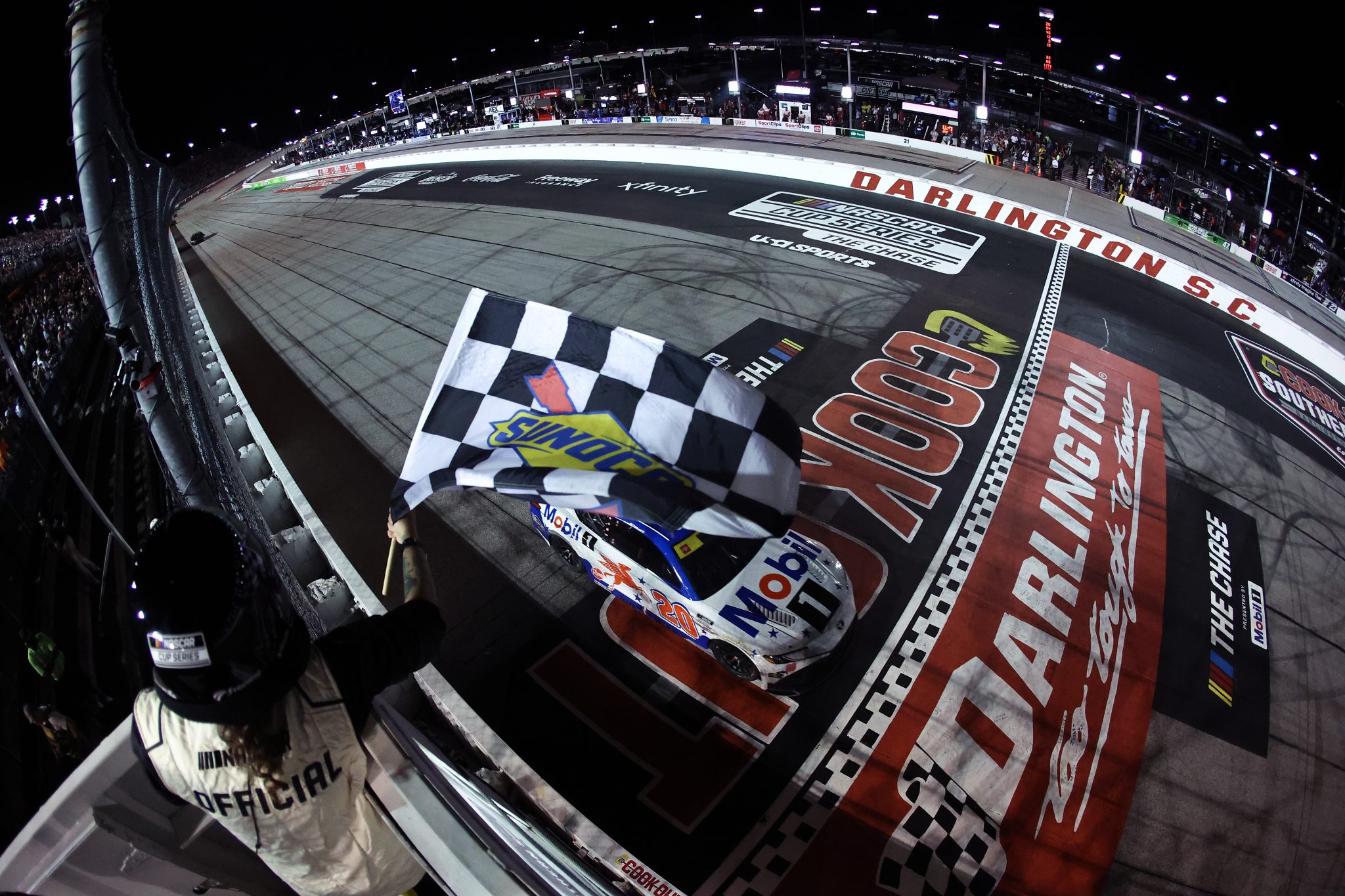 DARLINGTON, SOUTH CAROLINA - SEPTEMBER 06: Christopher Bell, driver of the #20 Mobil 1 Toyota, takes the checkered flag to win the NASCAR Cup Series Cook Out Southern 500 at Darlington Raceway on September 06, 2026 in Darlington, South Carolina. (Photo by James Gilbert/Getty Images) | Getty Images